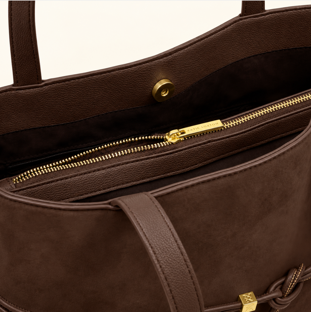 Interior view of Katie Loxton Lori Tote Bag in Bitter Chocolate showing magnetic closure, zippered valuables pocket and gold-tone hardware
