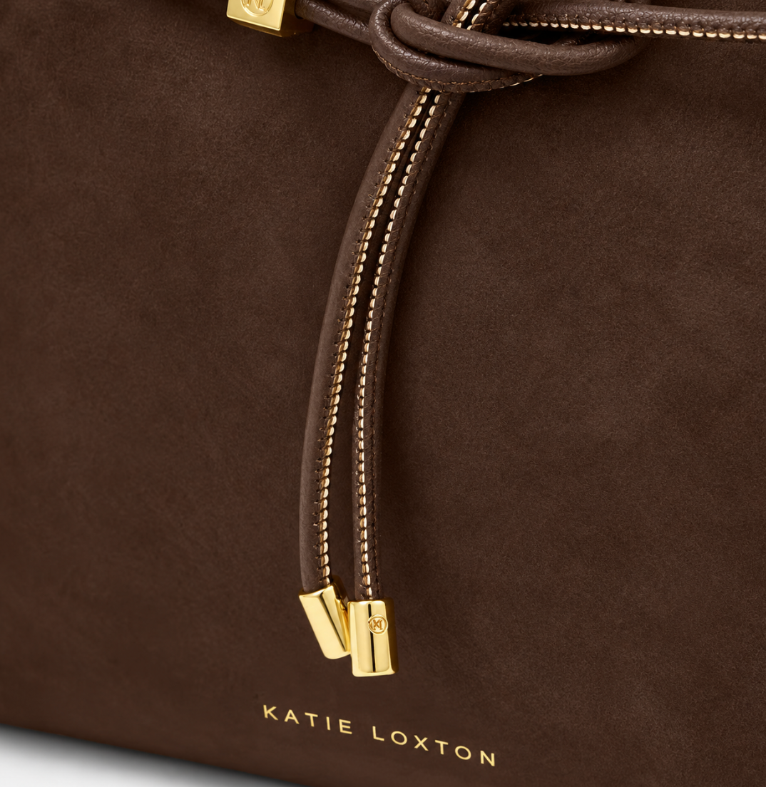 Close-up of Katie Loxton Lori Tote Bag in Bitter Chocolate showing knotted cord, gold-tone ends and Katie Loxton logo