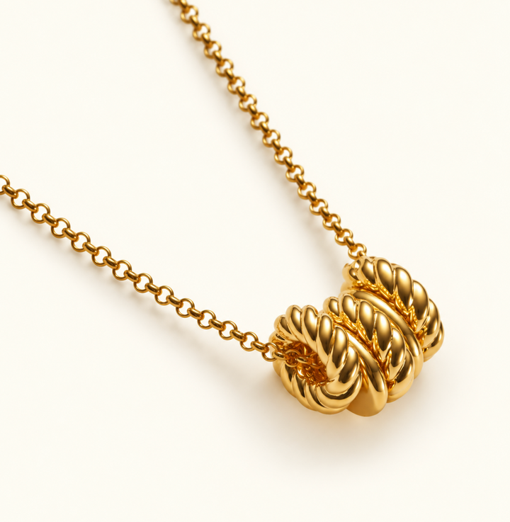 Close-up of Katie Loxton Laia Necklace showing textured gold ring pendant details and delicate chain