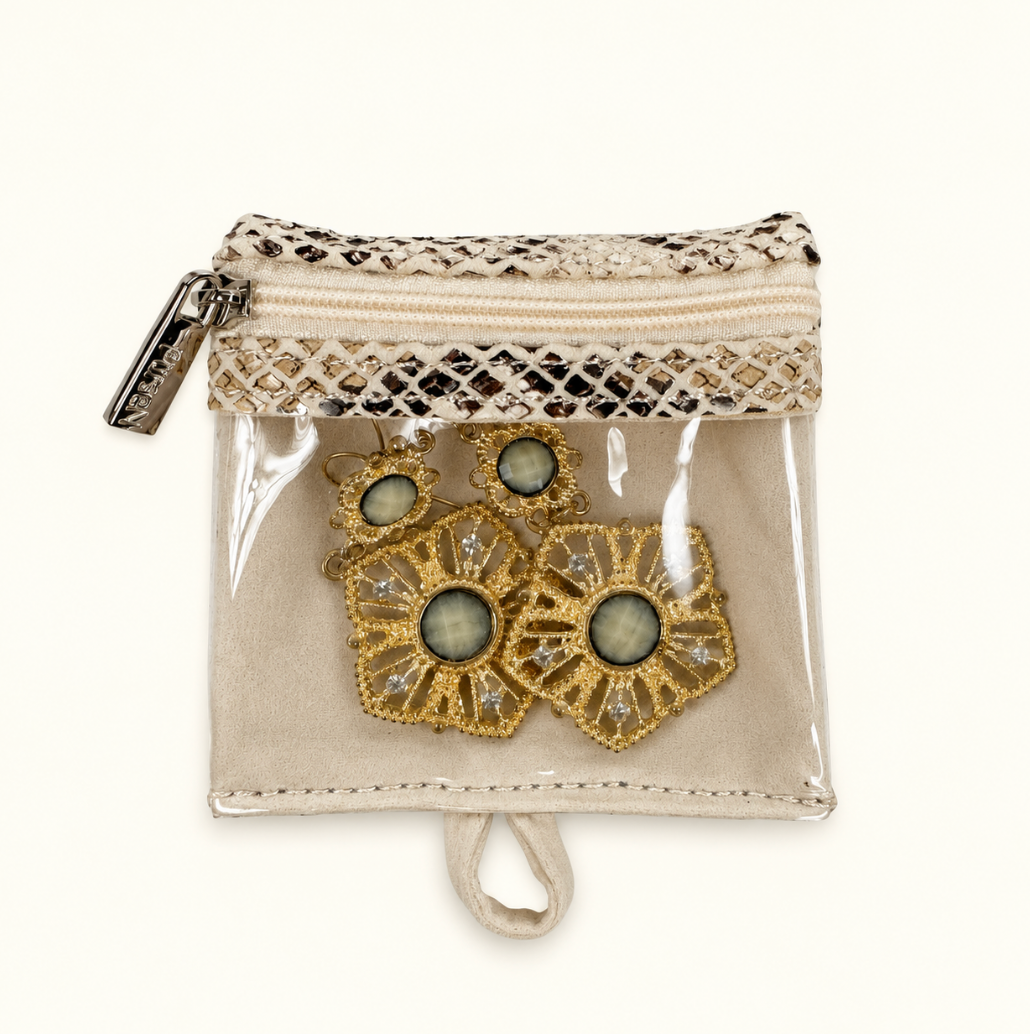 Safari Sands removable jewelry storage pouch with cream python print trim, silver zipper, clear PVC front, and gold floral earrings with green-gray stones on a cream background.