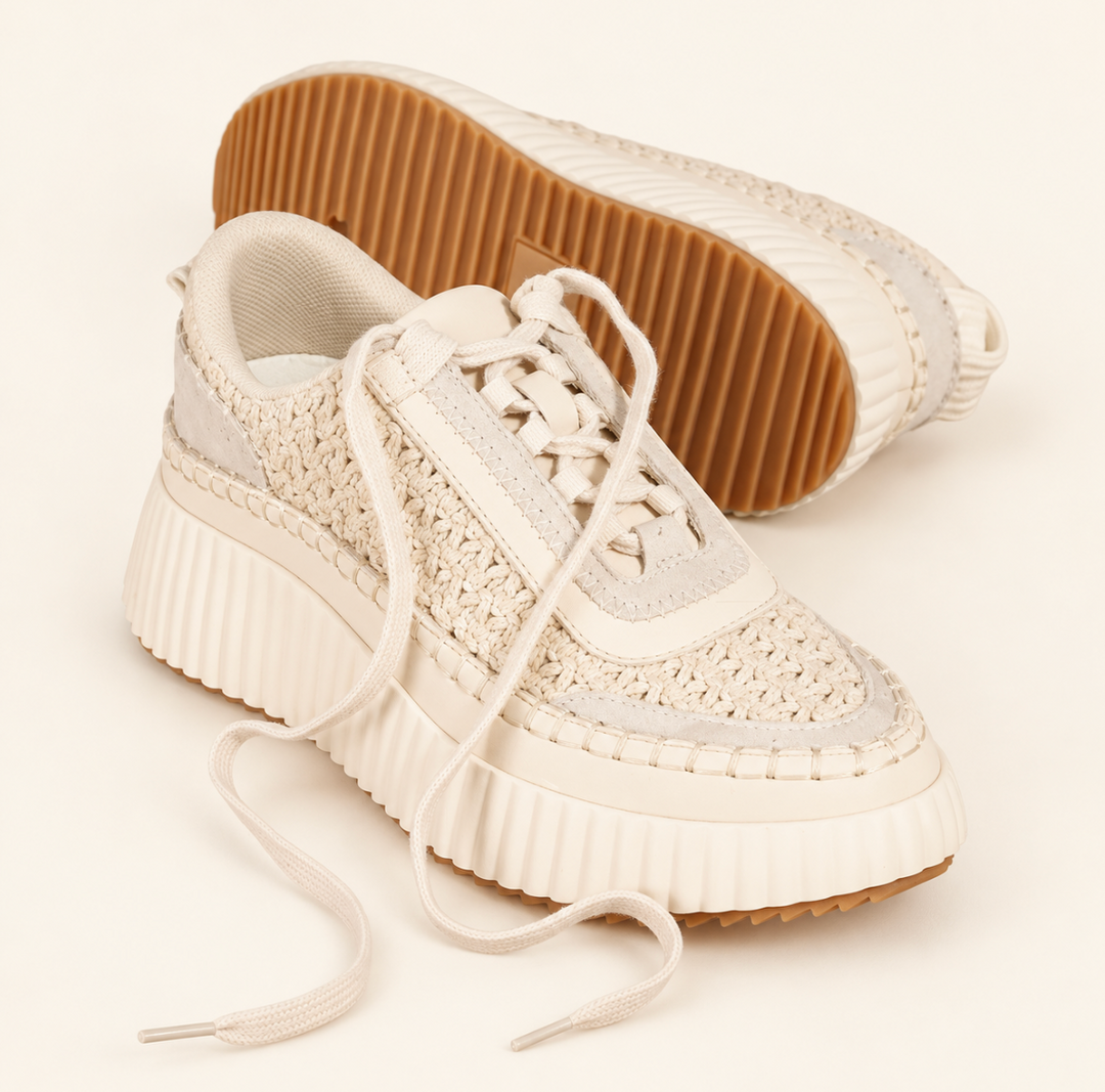 Cream Dolea Platform Sneakers showing detailed woven knit texture, lace-up front, cushioned collar, and tan rubber outsole on a cream background.