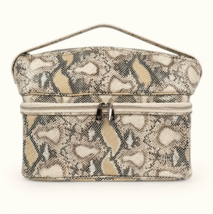 Stylist Travel Bag in Safari Sands cream python print featuring a heat-resistant top compartment, double zippered storage, and carrying handle on a cream background.