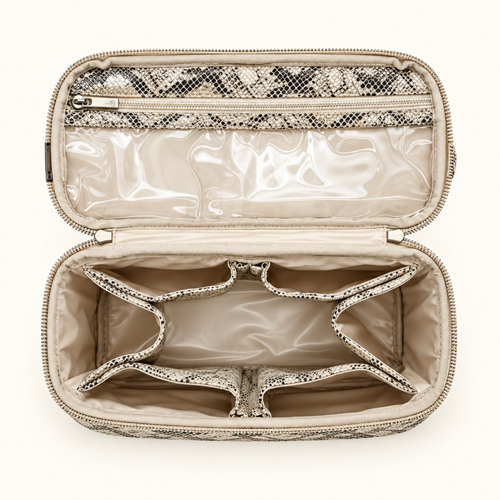 Overhead view of the Safari Sands Stylist Travel Bag featuring cream interior lining, clear zippered pocket, six built-in storage pockets, and spacious center compartment.