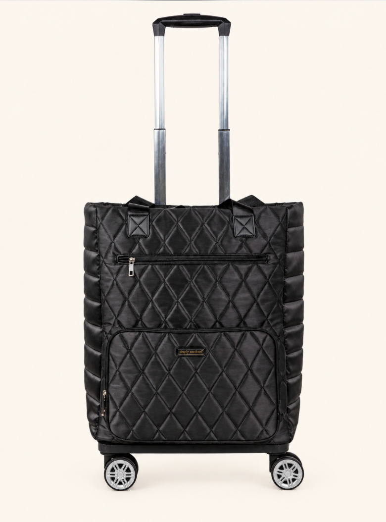 Simply Southern black quilted swivel rolling tote bag with diamond stitching, front zipper pockets, telescoping handle, and four spinner wheels.