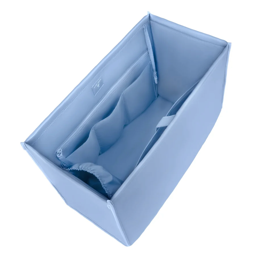 Light blue Case-Mate jelly tote bag organizer with zipper pocket and divided interior compartments.