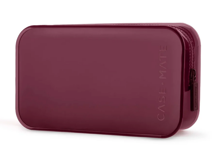 Burgundy Case-Mate travel organizer pouch with zip closure on white background.