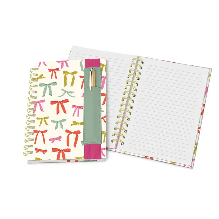 Open bow print spiral bound notebook with lined writing pages, elastic strap and pen holder, boutique planner journal gift
