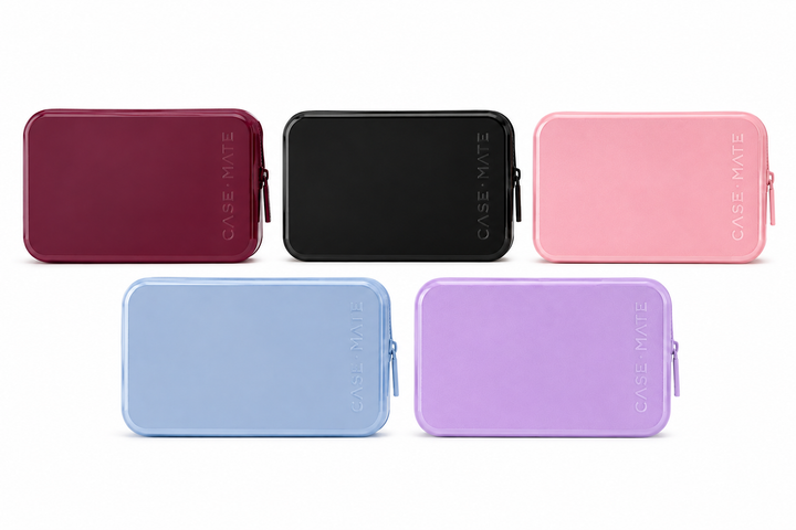 Case-Mate travel organizer cases in mulberry, black, pink, light blue, and lavender with zip closures.